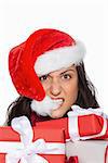 Irritated woman with christmas presents on white background