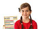 Cute little girl with an abacus on white background