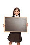 Cute pupil showing chalk board on white background
