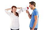 Man shouting through a megaphone at woman on white background