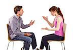 Sitting couple having an argument on white background