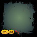 Grunge Halloween background with pumpkins and hanging spider