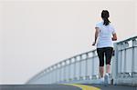 Young Japanese girl jogging