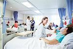 Doctors, nurses and patients in hospital room