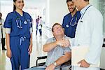 Doctor and patient shaking hands in hospital