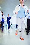 Doctor rushing down hospital hallway