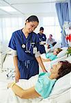 Nurse talking to patient in hospital room