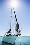 Couple standing on end of boat