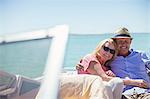 Couple sitting in boat on water