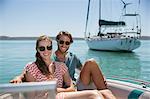 Couple sitting in boat on water