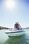 Couple standing in boat together