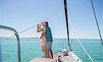 Couple standing on boat together