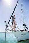 Couple standing on front of boat