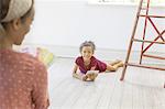 Young girl using digital tablet in living space