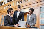 Lawyers examining documents in court