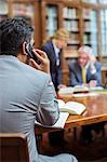 Lawyer talking on cell phone in chambers