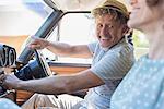 Older man starting car ignition