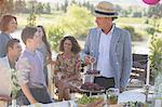 Family talking near picnic table