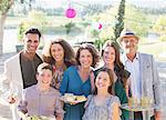 Family smiling together outdoors