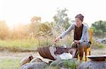 Mature woman having grill, Oland, Sweden