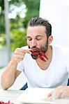 Man eating crayfish at crayfish party, Stockholm, Sweden