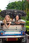 Young women on rickshaw, Bangkok, Thailand