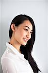 Studio shot of smiling young woman