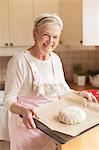 Senior woman preparing dough