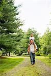 Two brothers walking on a country path.