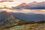 Panorama of Mountains -  sunset time. Beautiful peaks, clouds and sunlight. Carpathians