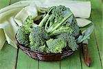 fresh organic broccoli in a wicker basket