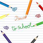 Back to school with colored pencils over notebook paper