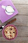 Healthy breakfast with muesli and milk. View from above on wooden table with copy space