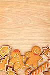 Homemade various christmas gingerbread cookies on wooden background with copy space