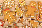 Homemade various christmas gingerbread cookies on wooden background