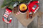 Christmas mulled wine with fir tree and decor on wooden table