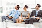 Young business people with notes in meeting at office