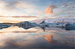 Winter sunset over Jokulsarlon, a glacial lagoon at the head of the Breidamerkurjokull Glacier on the edge of the Vatnajokull National Park, South Iceland, Iceland, Polar Regions