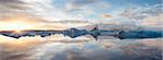 Panoramic view at sunset during winter over Jokulsarlon, a glacial lagoon at the head of the Breidamerkurjokull Glacier on the edge of the Vatnajokull National Park, South Iceland, Iceland, Polar Regions