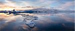 Panoramic view at sunset during winter over Jokulsarlon, a glacial lagoon at the head of the Breidamerkurjokull Glacier on the edge of the Vatnajokull National Park, South Iceland, Iceland, Polar Regions