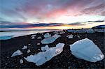 Icebergs at sunset on Jokulsa Beach, on the edge of the Vatnajokull National Park, South Iceland, Iceland, Polar Regions