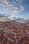 Clouds at dawn over salmon and white sandstone, White Pocket, Vermilion Cliffs National Monument, Arizona, United States of America, North America