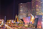 Neon lights, Las Vegas Strip South at night with cars leaving light streaks in front of City Center, Las Vegas, Nevada, United States of America, North America