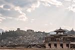 Lijiang architecture with Lion Hill and Wan Gu Tower, Lijiang, Yunnan, China, Asia