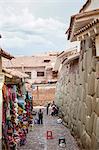 Shops along the the Inca wall at Hathunrumiyoq Street, las piedras del los 12 angulos (Stone of 12 Angles), Cuzco, UNESCO World Heritage Site, Peru, South America