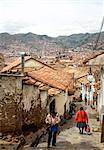 Street scene in San Blas neighbourhood with a view over the rooftops of Cuzco, UNESCO World Heritage Site, Peru, South America