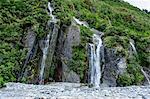 Huge waterfall on the bottom of Franz-Joseph Glacier, Westland Tai Poutini National Park, Southern Alps, UNESCO World Heritage Site, South Island, New Zealand, Pacific