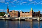 Vasa Bridge on the Norrstrom River in front of (from left to right) Riddarholmen Church, Gamla Riksarkivet (Old National Archives Building) and Norstedt Building, Riddarholmen, Stockholm, Sweden