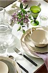 Close-up of Table Setting with Flowers in Dining Room