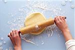 Overhead View of Woman Rolling out Sugar Cookie Dough, Studio Shot